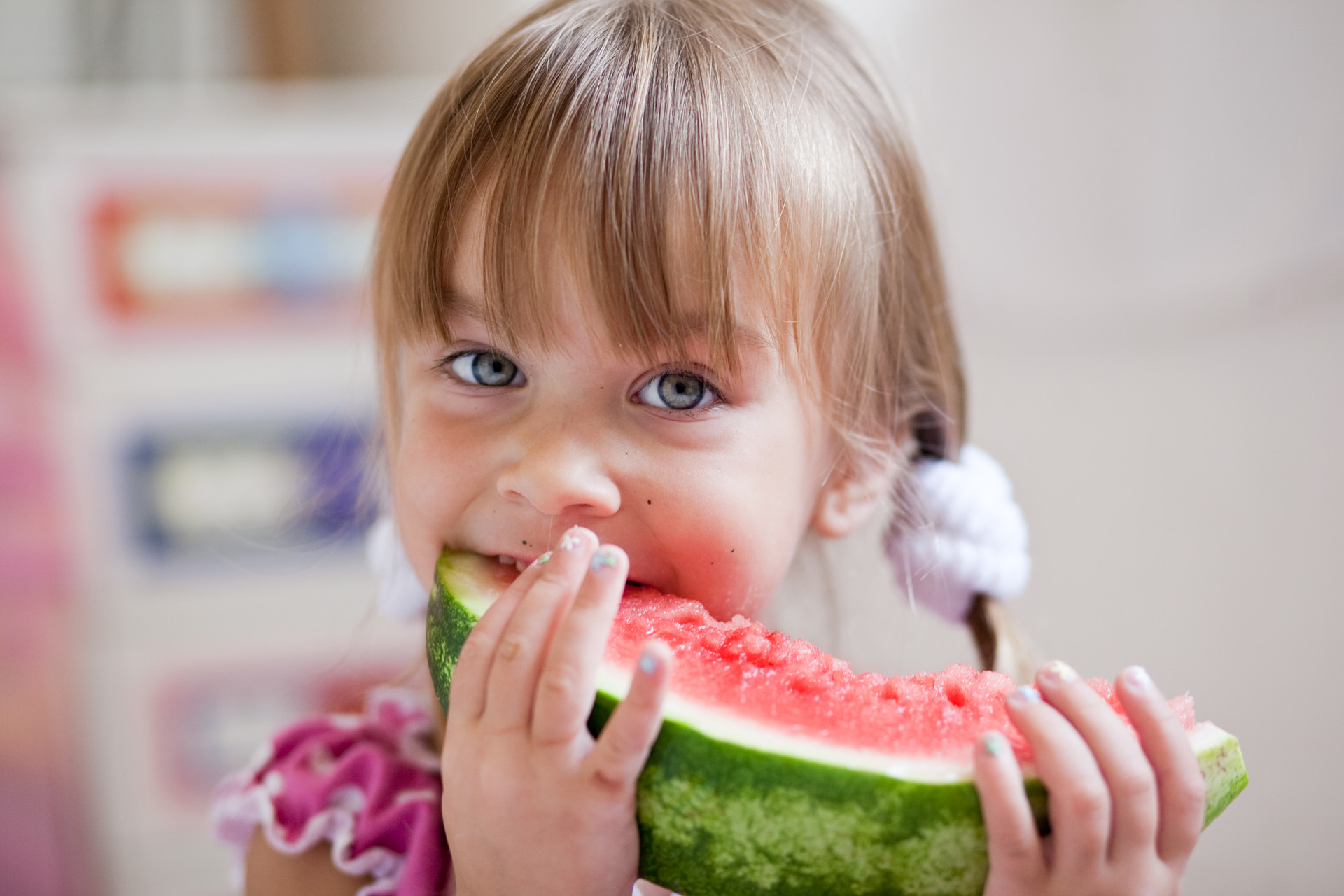 Fauuny child eating watermelon closeup